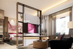 A modern hotel room with a bed, a desk, a chair, a round coffee table, and a TV. - Fave+ Hotel Lampung (Bandar Lampung)