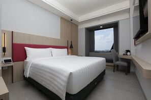 Habitación Deluxe | Caja fuerte, escritorio, wifi gratis y ropa de cama