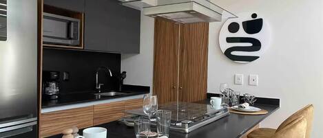 Coffee/tea maker, fridge, microwave, oven