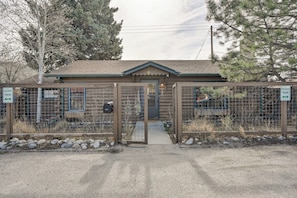 A gated entrance to a building with a sign indicating reserved parking. - The Cabin Down Below (Buena Vista)
