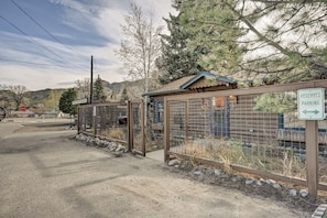 A gated parking area with a sign indicating reserved parking. - The Cabin Down Below (Buena Vista)