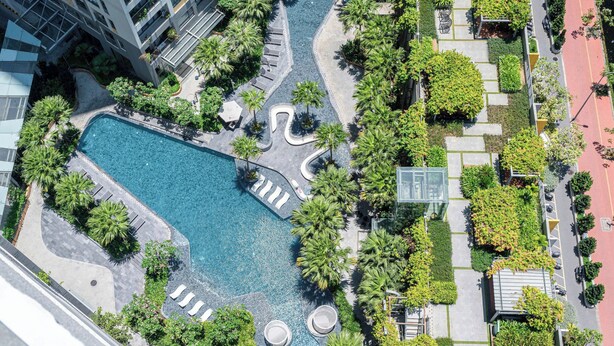 An aerial view of a modern hotel with a central swimming pool, surrounded by palm trees and lounge areas. - Nice stay next to Thao Dien area, 3brs, 5min to MRT, central (Thành phố Hồ Chí Minh)