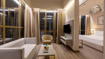 Hypo-allergenic bedding, desk, laptop workspace, blackout drapes