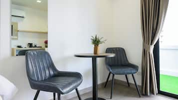 Junior Suite, Balcony, City View | Living area | 32-inch Smart TV with digital channels