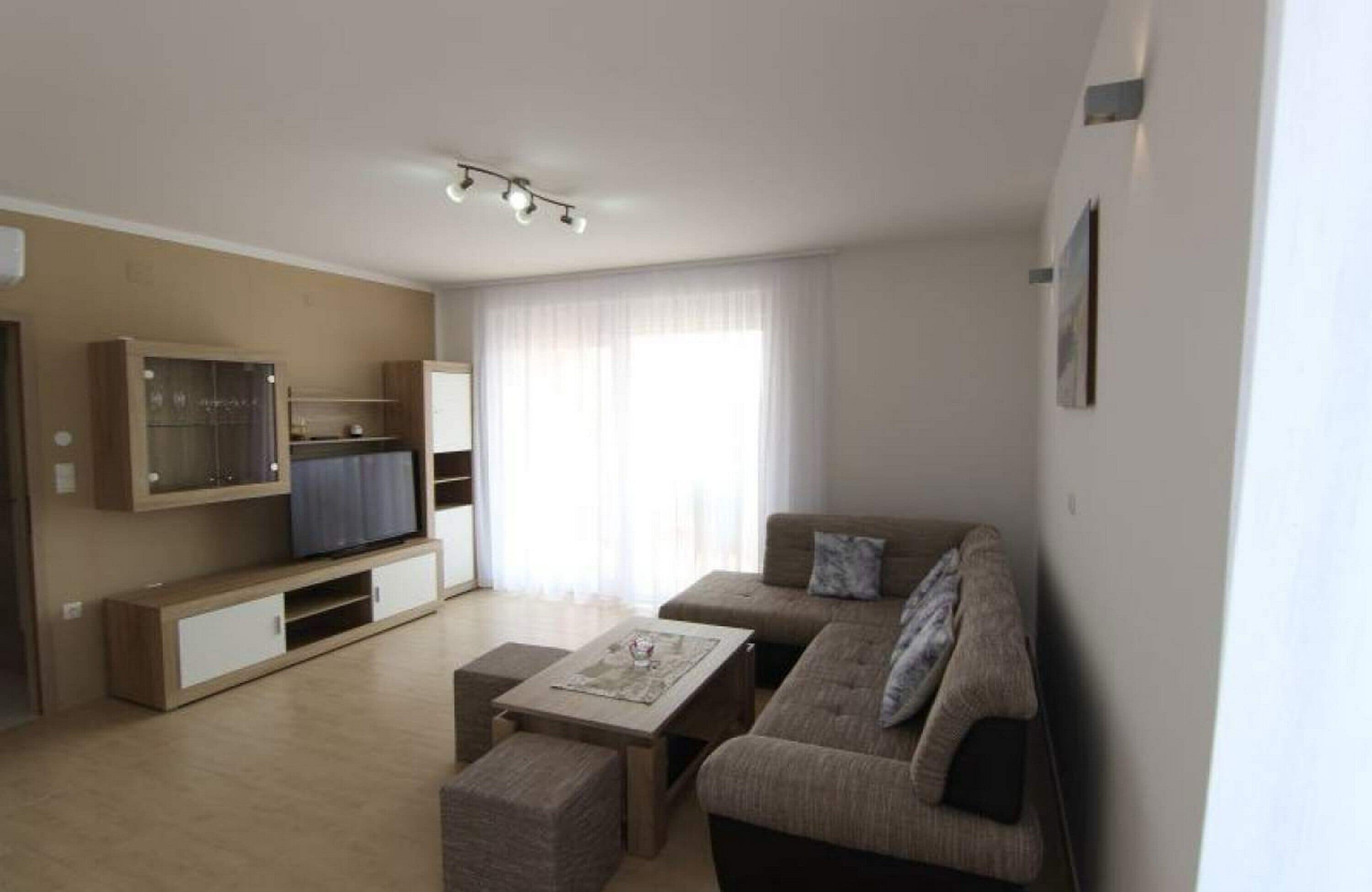 Classic-Apartment, eingeschränkter Meerblick | Wohnbereich