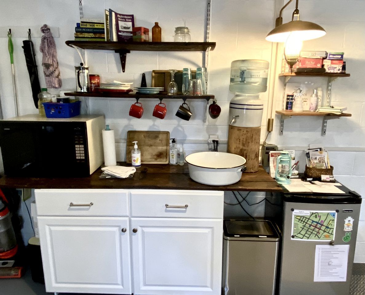 Fridge, microwave, coffee/tea maker, cookware/dishes/utensils