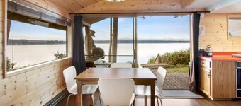 Incredible Sunset at Beachfront Glamping Cabin on Private, Herron Island with Fire Pit and Kayaking near Olympia, Washington