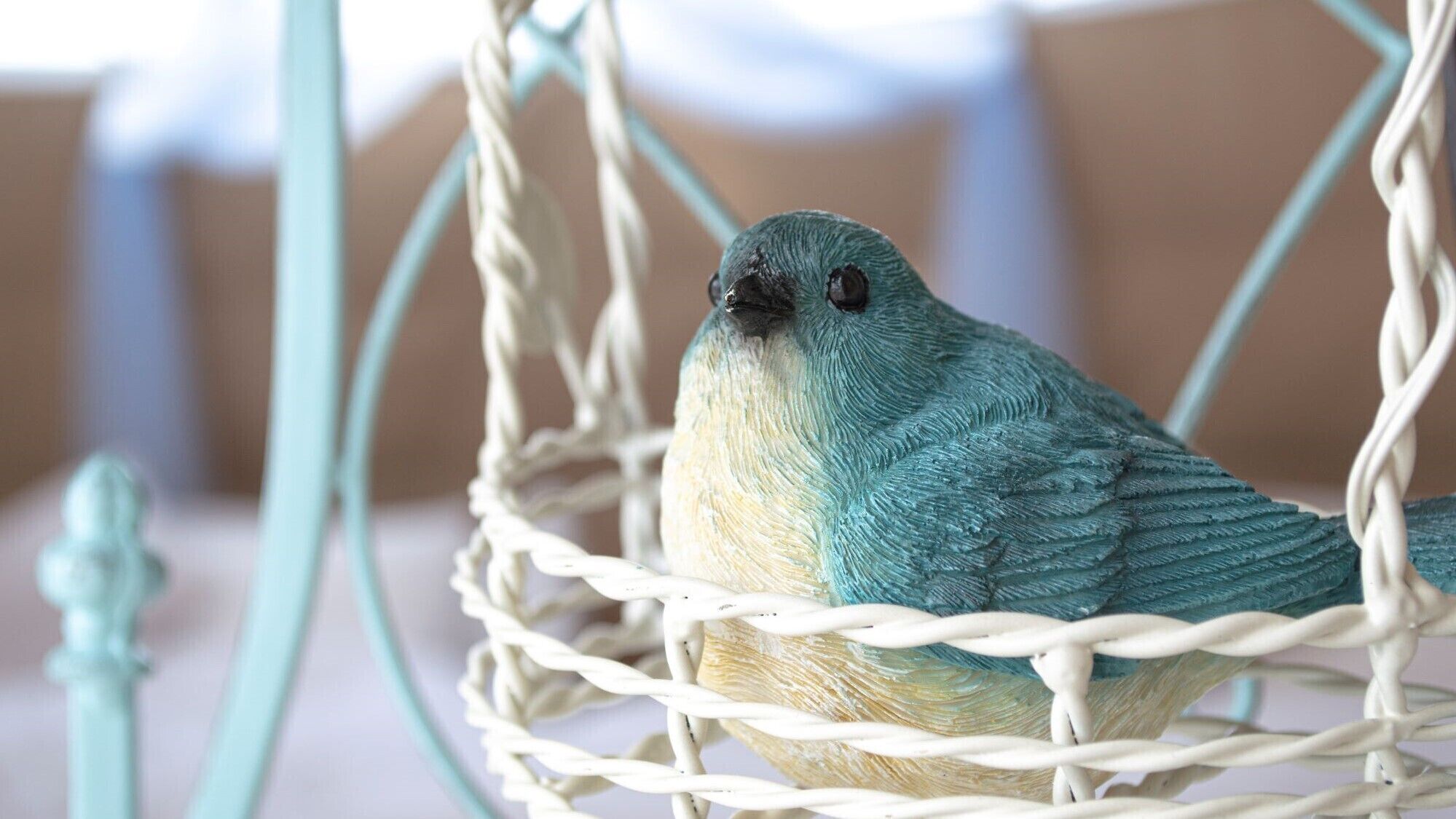 A bird in a woven basket.