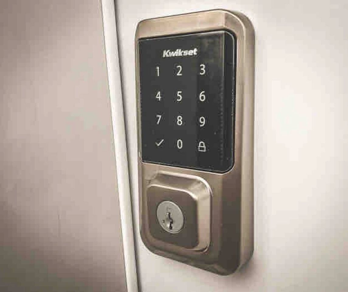 A Kwikset electronic keypad lock on a door.