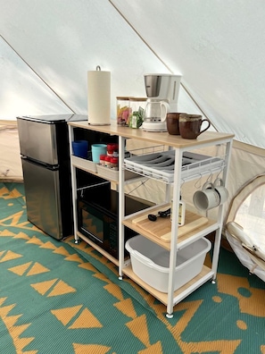 Fridge, microwave, coffee/tea maker, cookware/dishes/utensils