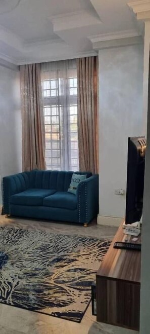 Living area - Legacy Homes 1A Apartment (Dar es Salaam)