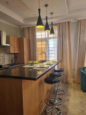 Private kitchen - Legacy Homes 1A Apartment (Dar es Salaam)