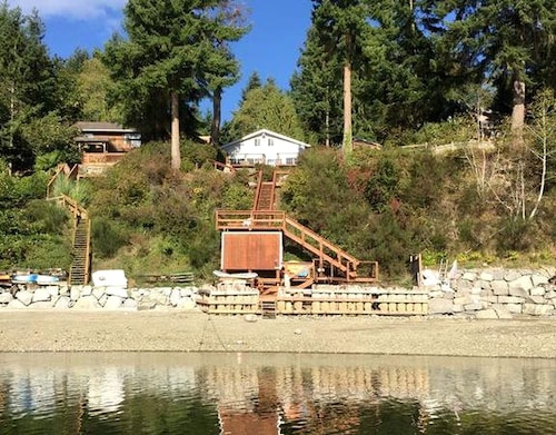 Amazing Sunrise at Coastal Luxury Cabin Rental on Herron Island with Fire Pit and Paddle Boarding near Olympia, Washington