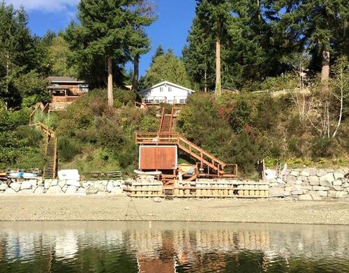 Amazing Sunrise at Coastal Luxury Cabin Rental on Herron Island with Fire Pit and Paddle Boarding near Olympia, Washington