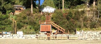 Amazing Sunrise at Coastal Luxury Cabin Rental on Herron Island with Fire Pit and Paddle Boarding near Olympia, Washington
