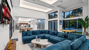 Comfort Villa | Living area | 55-inch Smart TV with digital channels