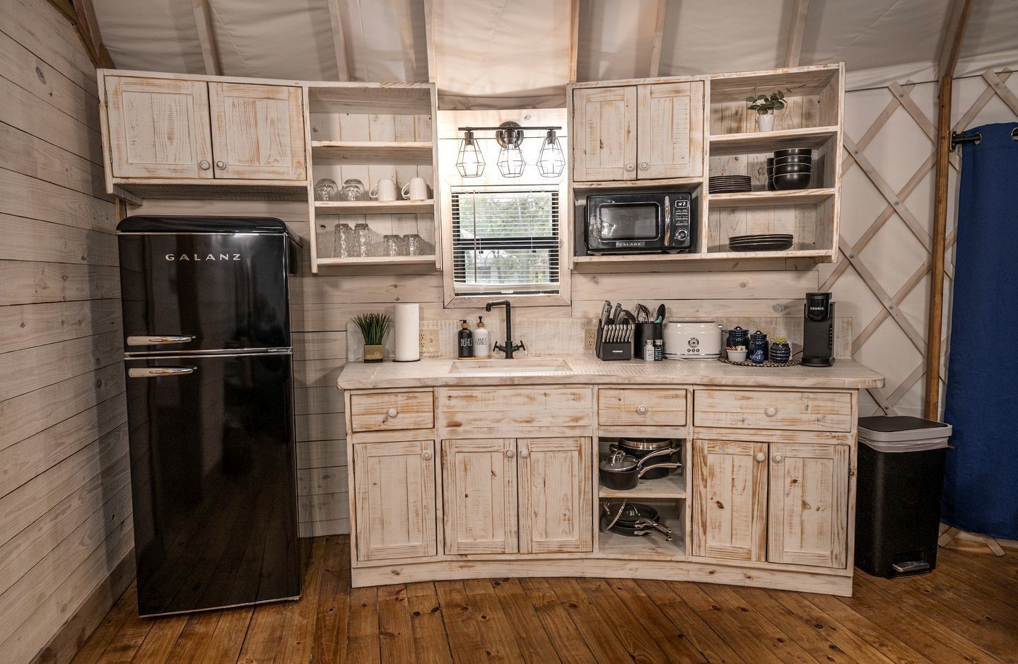 Coffee/tea maker, fridge, cookware/dishes/utensils