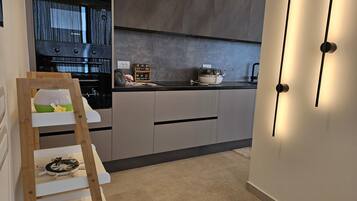 Family Penthouse, Multiple Bedrooms, Sea Facing (La Terrazza Azzurra) | Private kitchen | Fridge, microwave, oven, stovetop