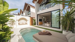 A modern house with a swimming pool, outdoor seating, and large windows. - Villa Enola Uluwatu (Uluwatu)