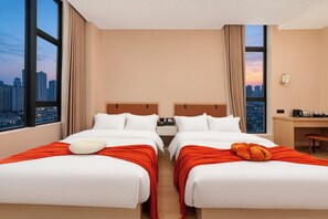 A hotel room with two beds, a desk, and a view of the cityscape. - Guangzhou Hiram International Hotel - Free shuttle bus to Guangda Trade City and Xiaobei Market (Guangzhou)