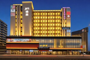A modern hotel with a prominent signage for Hiram Hotel, multiple floors, and a large glass facade. - Guangzhou Hiram International Hotel - Free shuttle bus to Guangda Trade City and Xiaobei Market (Guangzhou)