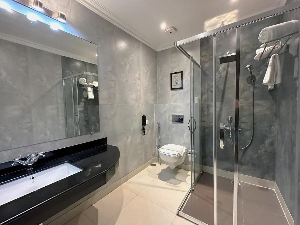 Superior Double or Twin Room, Garden View | Bathroom | Shower, hair dryer, slippers, towels