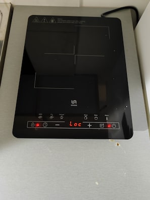 A black induction cooktop with a digital display and control buttons. - The Best offer! 2-bedroom apartment in Vracar with AC for relaxing stays (Beograd)