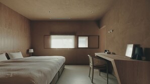 A bedroom with a bed, desk, chair, and a window with blinds. - Old Soma Residence Kazeno Heritage (Hakodate)
