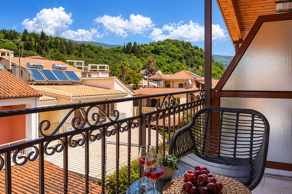 Spacious balcony with stylish mountain views and comfortable seating. A perfect place to relax, sip a drink, and enjoy the peaceful surroundings