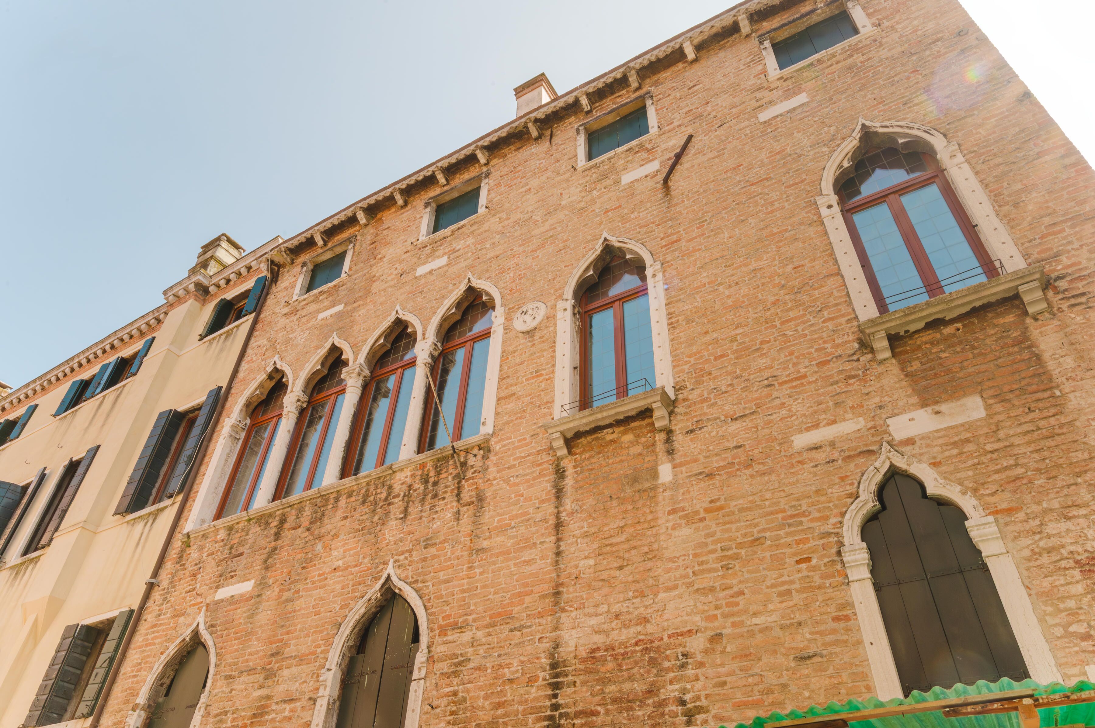 A historic building with arched windows and a brick facade.