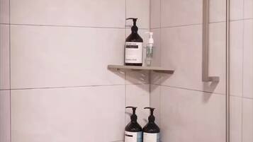 Shower, towels, soap, toilet paper