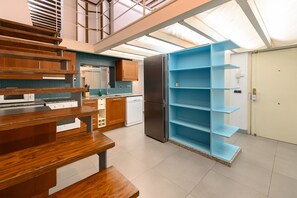 A modern kitchen with wooden cabinetry, a built-in oven, and a stainless steel refrigerator. - (ESA121ID) Spacious Duplex in the center of Madrid (Madrid)