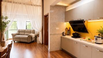 Family Suite, Hill View | Private kitchen | Fridge, microwave