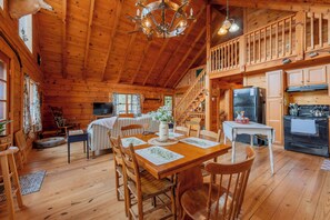 Dining - Peaceful log cabin retreat with wraparound deck, open living space, full kitchen, cozy bedrooms & scenic wooded views. (Floyd)