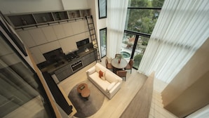 A modern interior with a kitchen, dining area, and a balcony with a pool view. - Urban 2br Apt in Central Area (Panama City)