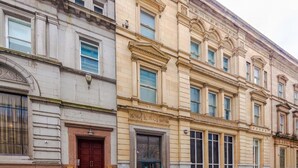 A multi-story building with classical architecture, featuring large windows and a prominent entrance. - City Centre Flat Perfect for Groups Weekends (Liverpool)