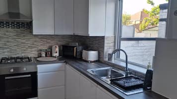 House, Multiple Beds | Private kitchen