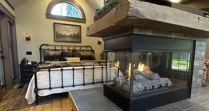 Walk to the Britt Festival and downtown Jacksonville from this newly remodeled luxury cottage. Features a king bed with luxury linens, dramatic centerpiece fireplace, pull-out sofa, full kitchen, and spa-style bathroom.
