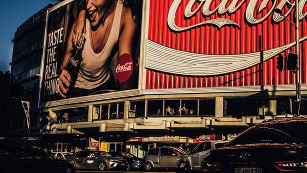 A building with a large Coca-Cola advertisement on the side. - Hotel Emerald (Potts Point)