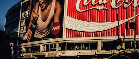 A building with a large Coca-Cola advertisement on the side.