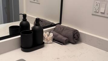 Hair dryer, towels, soap, toilet paper
