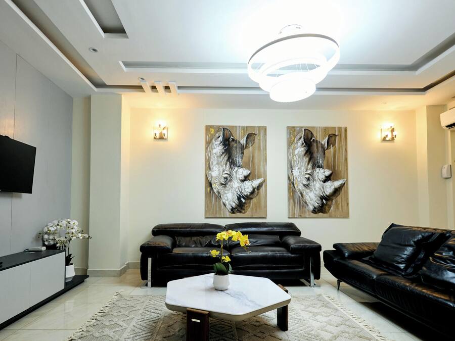 Family Apartment, City View | Living area | 55-inch Smart TV with digital channels