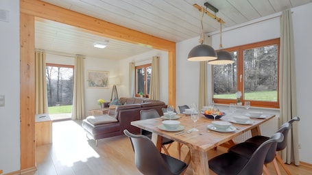 Dining. Holiday Home 'Waldfee – Stylish House' with Mountain View and Sauna