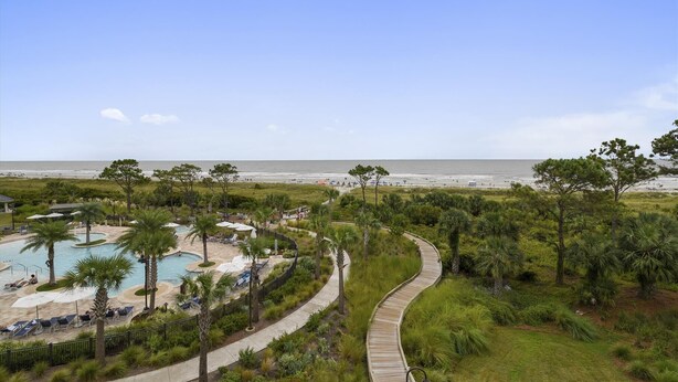 A resort with a pool, beach, and a boardwalk. - Sunset Rentals | Ocean Dunes 121 (Hilton Head Island)