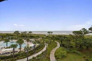 A resort with a pool, beach, and a boardwalk. - Sunset Rentals | Ocean Dunes 121 (Hilton Head Island)