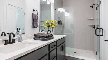 Shower, hair dryer, towels, shampoo