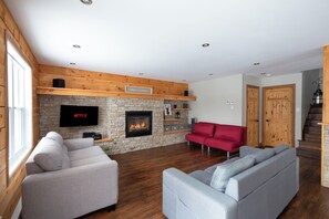 Unclassified image, 2 of 50, button - L'Exode au Ruisseau | 4season Spa | Lake | PoolTable | AC |In/Out Fireplace| BBQ (Saint-Adolphe-d'Howard)