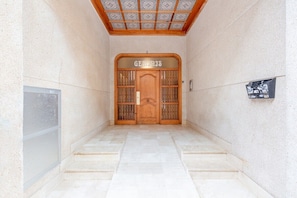 A hallway with a wooden door labeled "GEMINI'S" leading to a room. - Fidalsa Feel the Sea (Guardamar del Segura)
