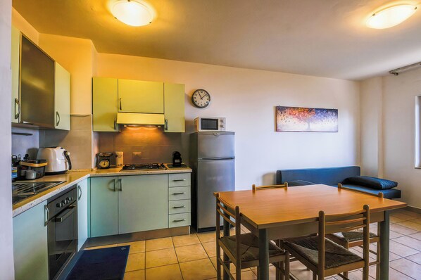 Appart'hôtel, vue colline | Cuisine privée
