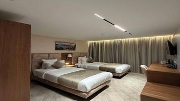 Premium bedding, memory-foam beds, free minibar, in-room safe